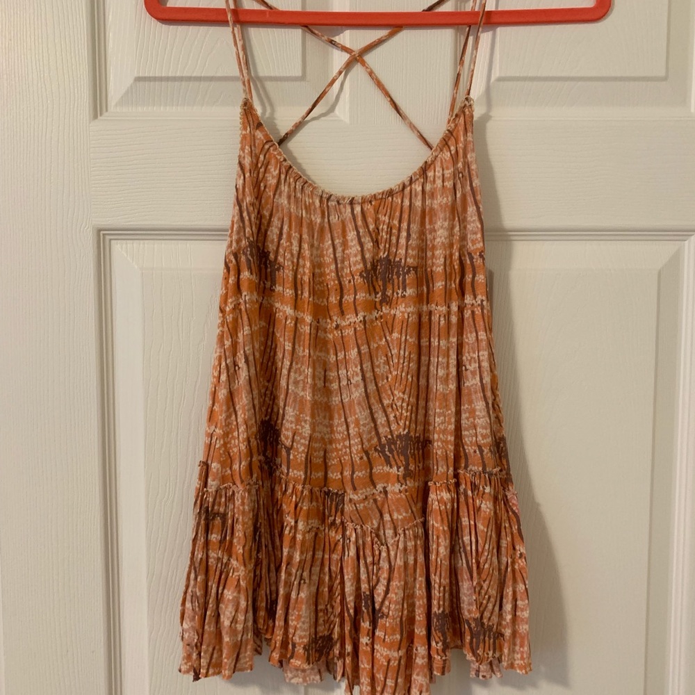 Free people criss cross tank- small tear
